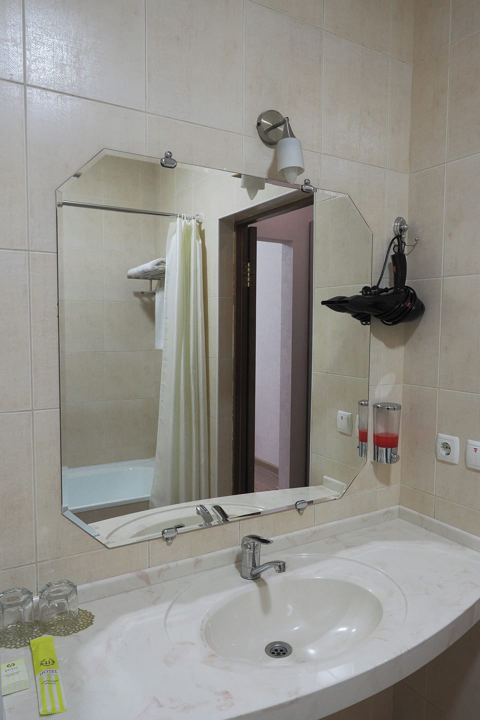 Hair dryer, slippers, towels, soap