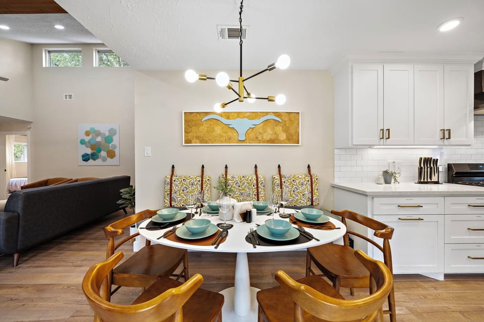 Spacious dining table that sits 7 with full tableware and silverware included.