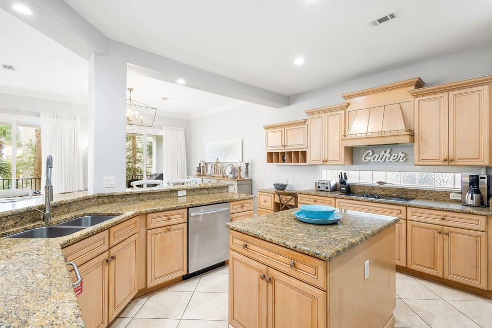 Step into your spacious gourmet kitchen where granite countertops and premium appliances make cooking a joy during your stay.