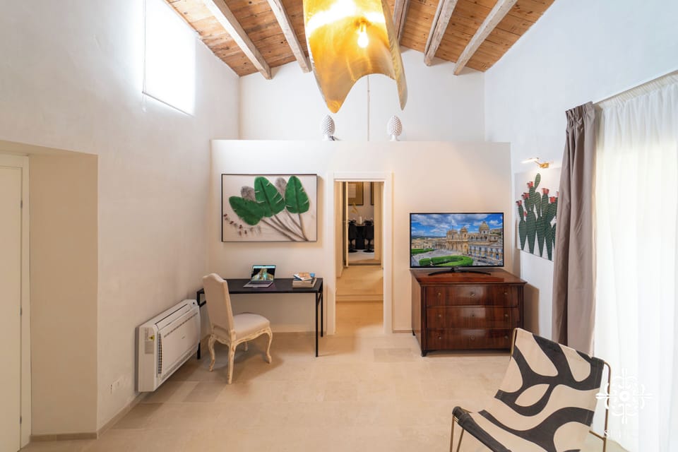 Design Duplex, Balcony, Courtyard View | Living area | 50-inch Smart TV with satellite channels