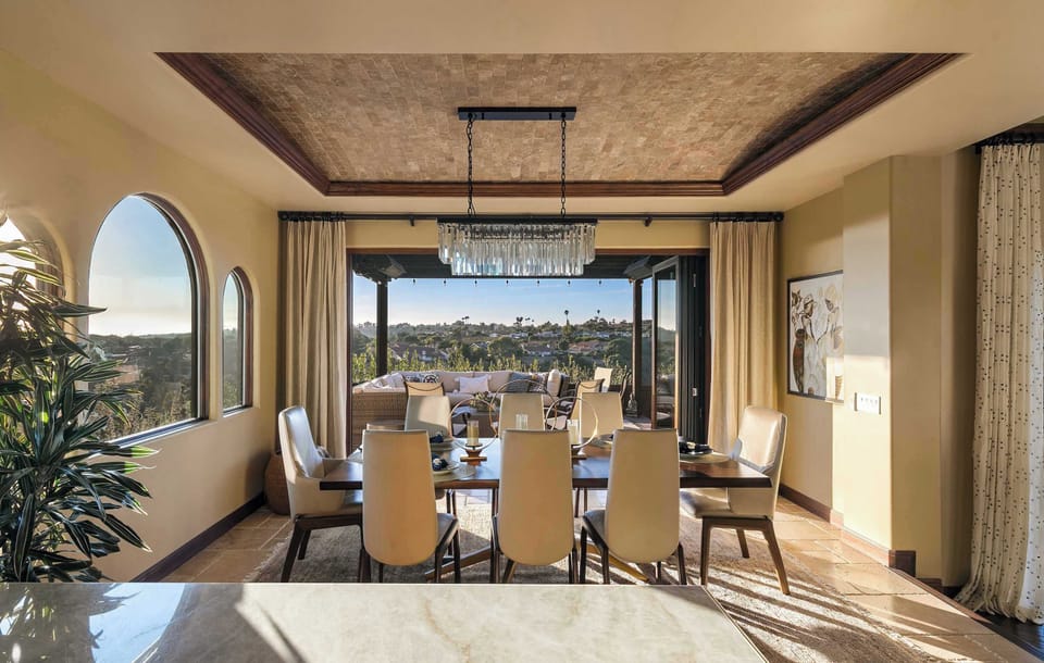 Accordion doors open seamlessly to the outdoor oasis