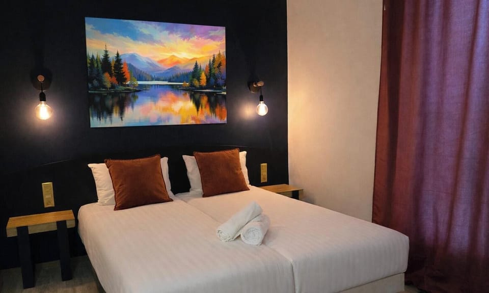 Premium bedding, desk, laptop workspace, blackout drapes