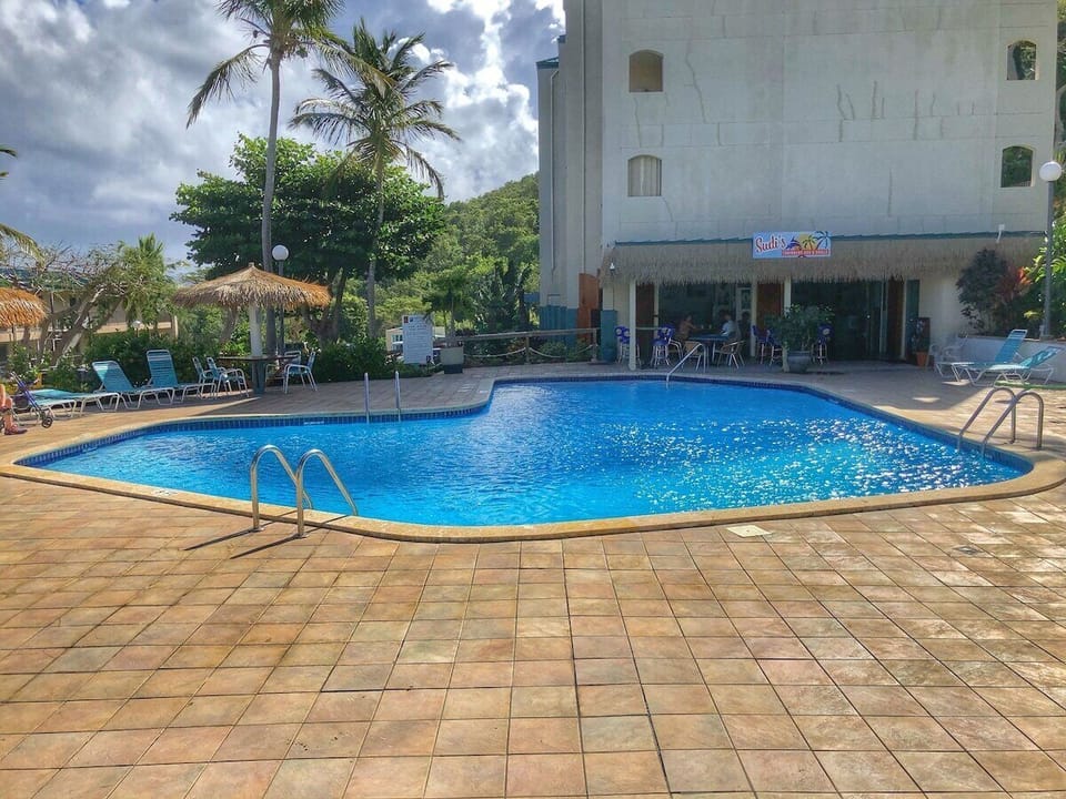 Pool by condo and Sudis Bar and Grill
