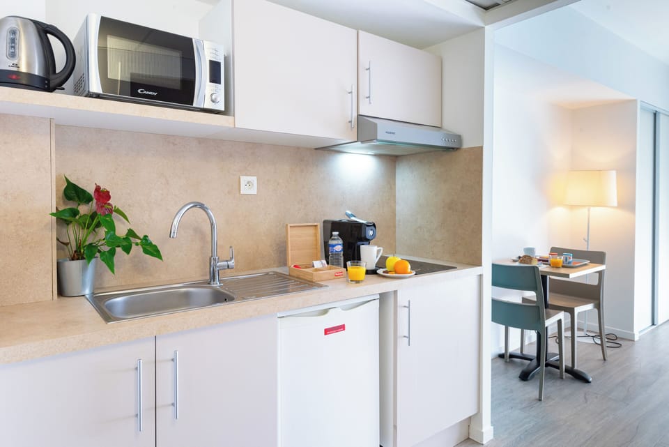 Mini-fridge, microwave, stovetop, coffee/tea maker