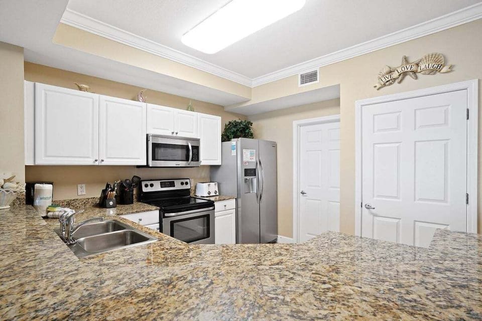 Full kitchen with stainless appliances and all cooking essentials