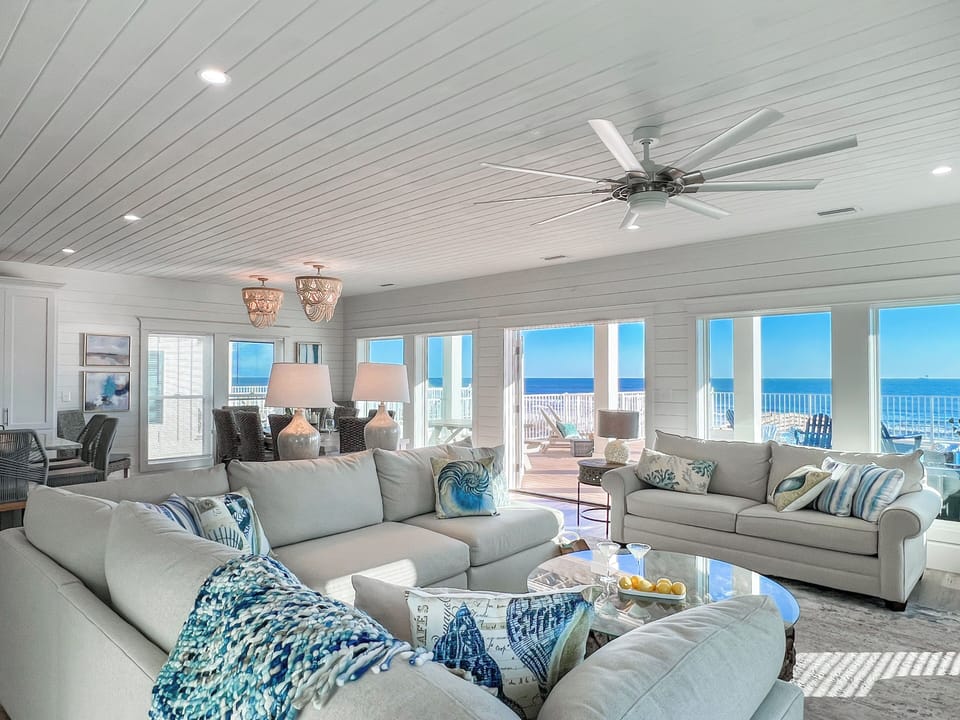 The main floor boasts a wall of windows that leads directly to the Gulf.