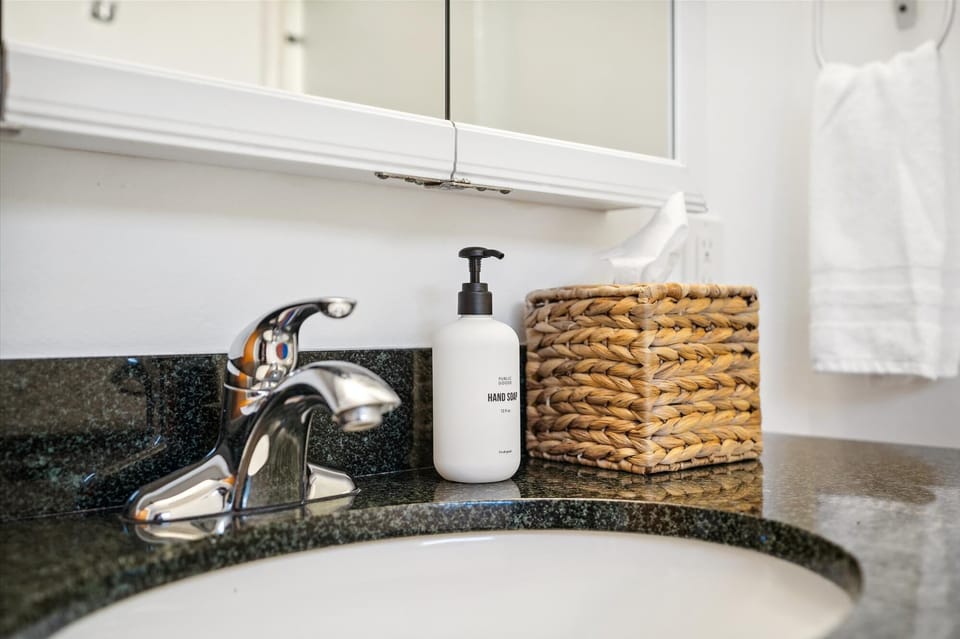 Enjoy premium Public Goods hand soap in the bathroom, offering a luxurious touch of simplicity and sustainability for your stay