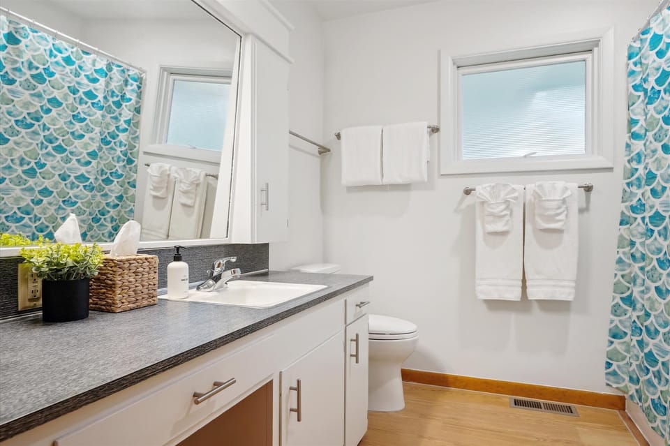 Bathroom equipped with linens, soaps, and more.