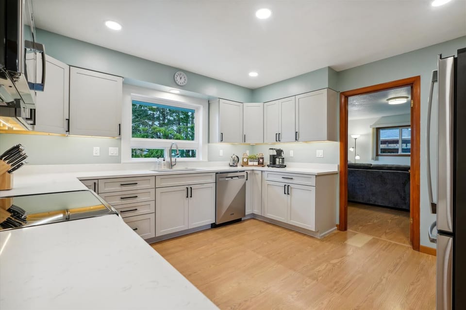 Cook in style with this spacious kitchen, complete with top-of-the-line appliances, ample storage, and plenty of counter space for preparing your favorite meals.