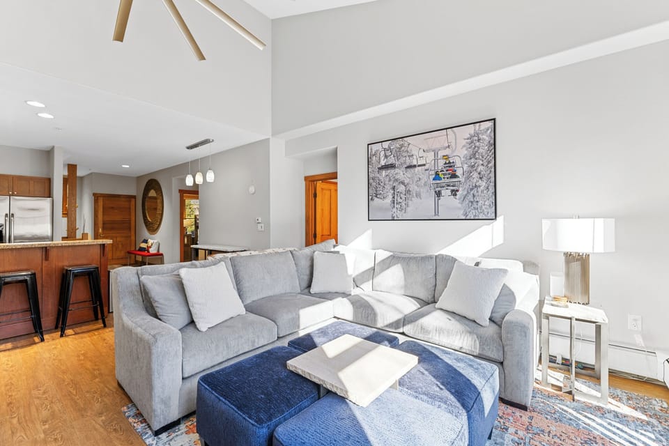 Sink into plush sectional seating where natural light streams through, creating the perfect spot to unwind after your mountain adventures.