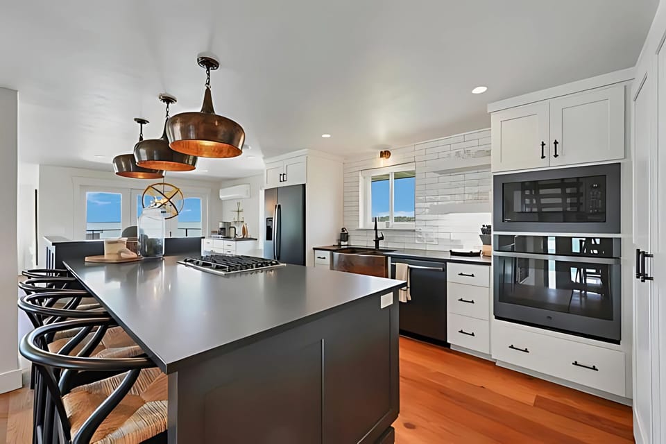 Full-size kitchen featuring sleek stainless steel appliances for all your cooking needs!