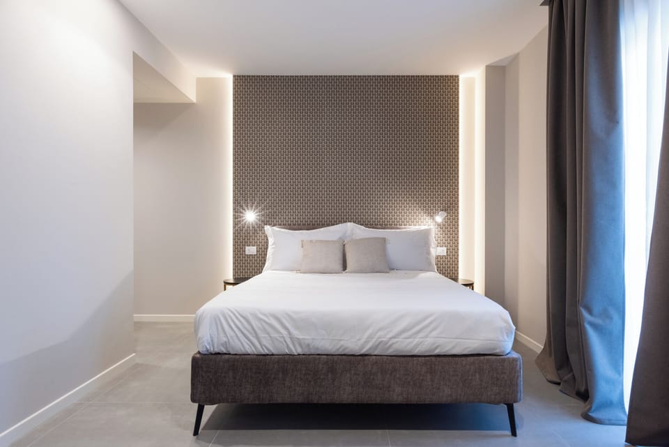 Deluxe Triple Room, Balcony | Free minibar, desk, laptop workspace, soundproofing