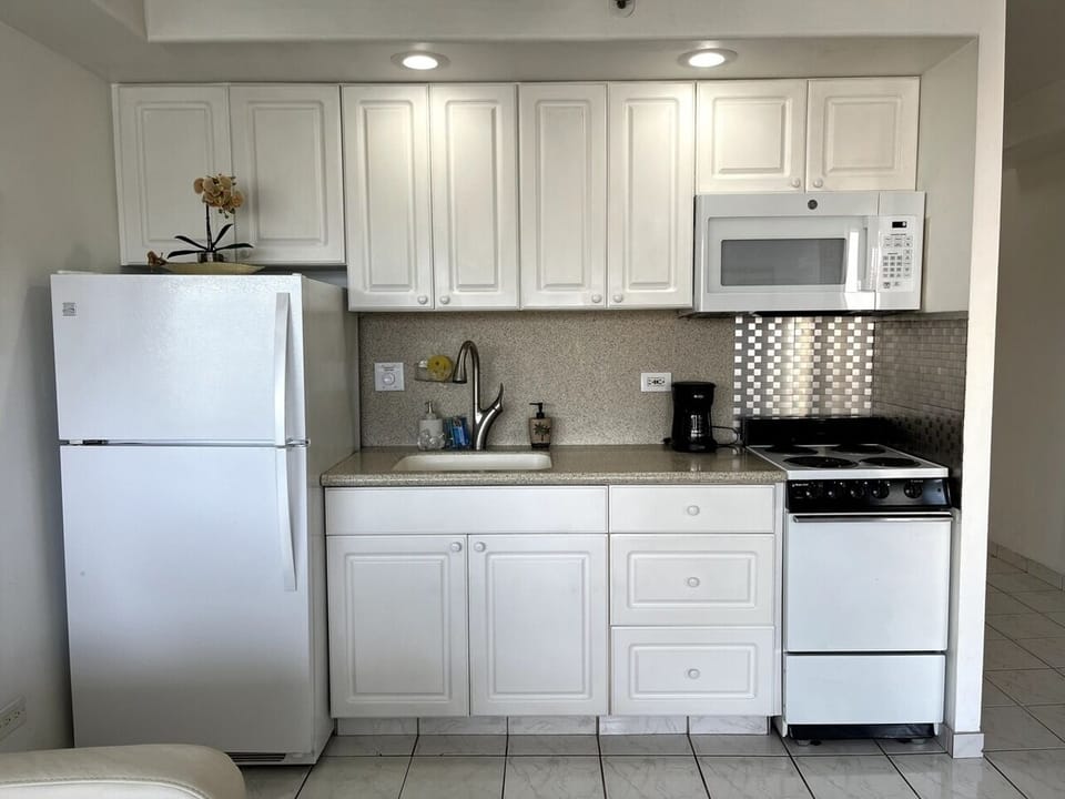 Full kitchen for preparing meals.