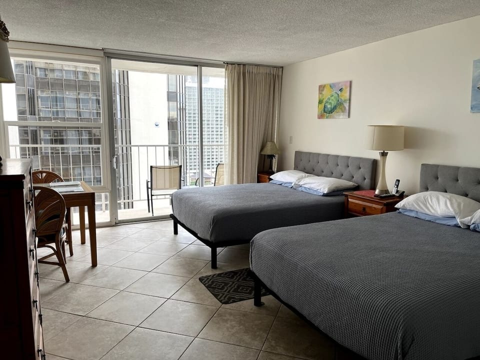 Two queen beds with new mattresses (2022).  

Open and airy room.