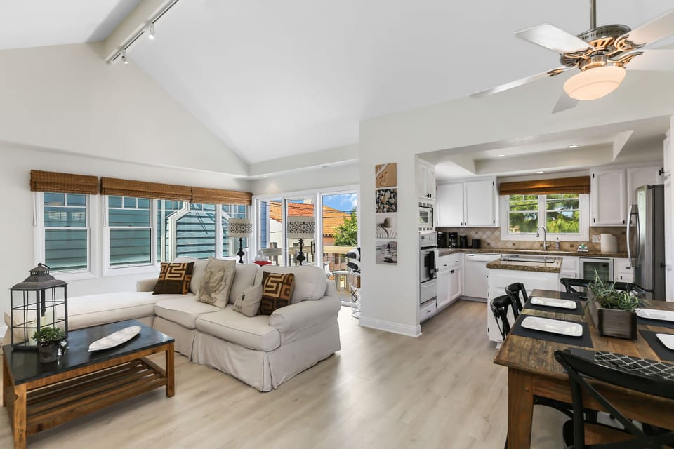 Living room with gas fireplace, cable TV, and balcony access