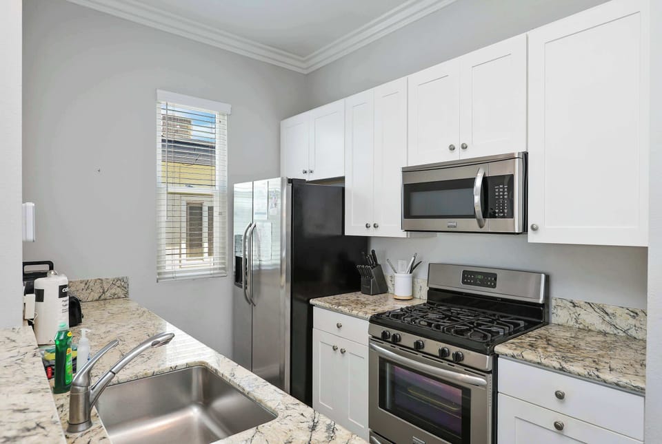The open, airy kitchen offers ample space & all the comforts of home