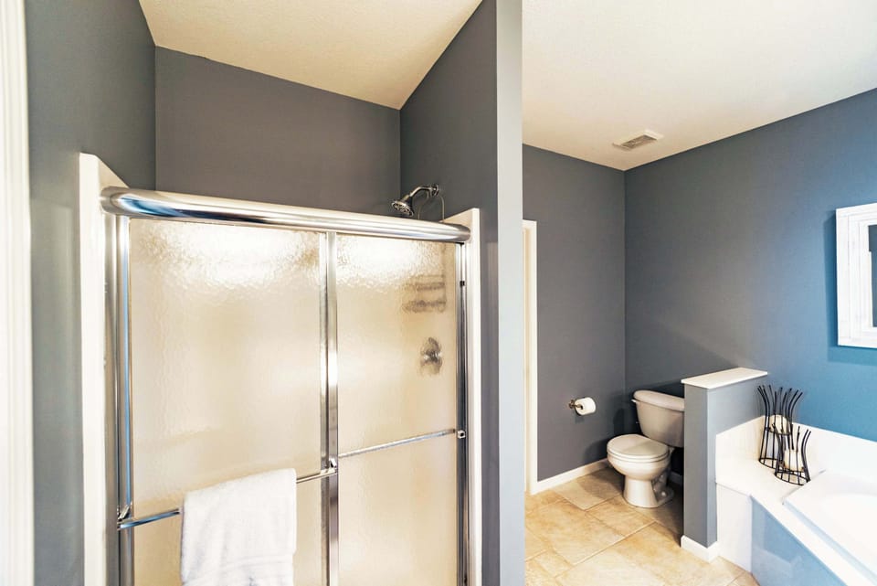 The master ensuite offers a double vanity, shower, & jetted soaking tub