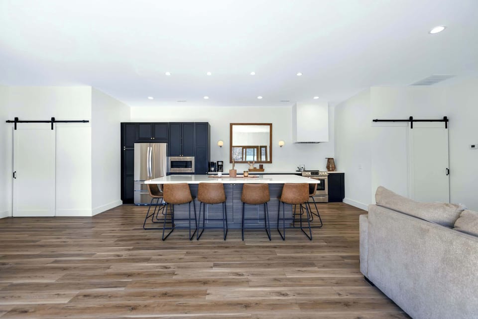 The gorgeous, updated kitchen offers ample space & all the comforts of home