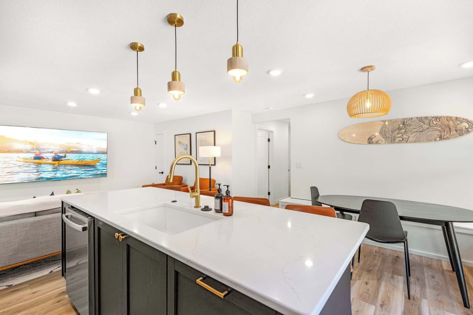 The cozy, open kitchen offers ample space & all the comforts of home