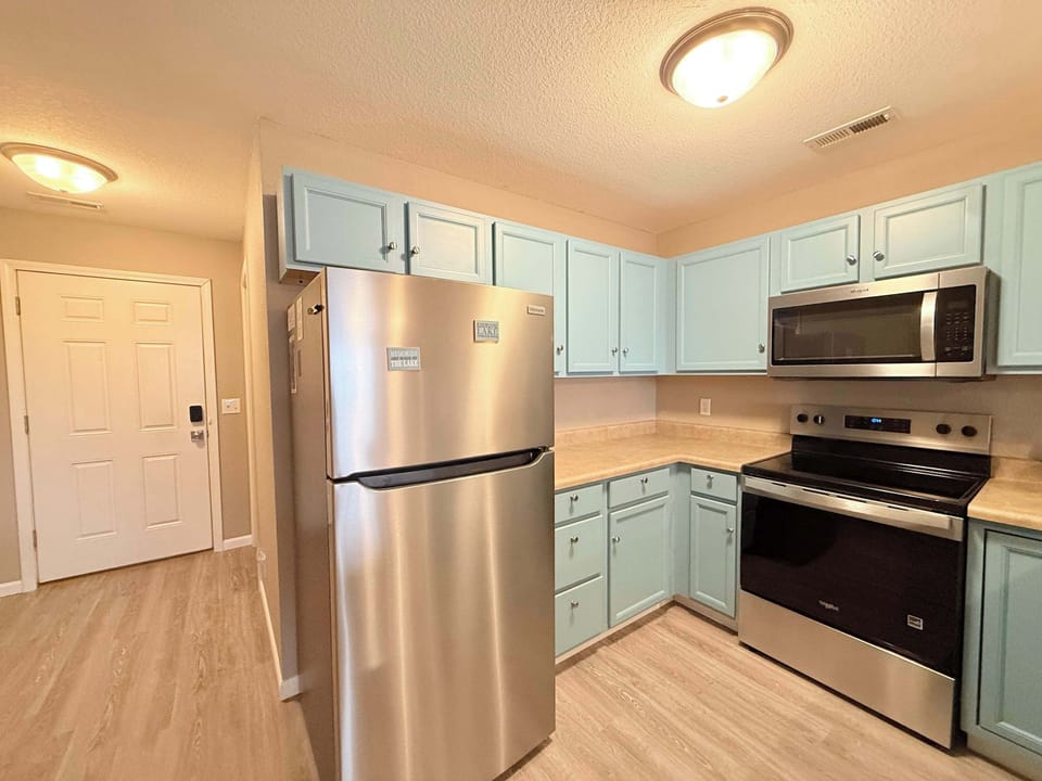 This quaint kitchen offers ample space & all the comforts of home
