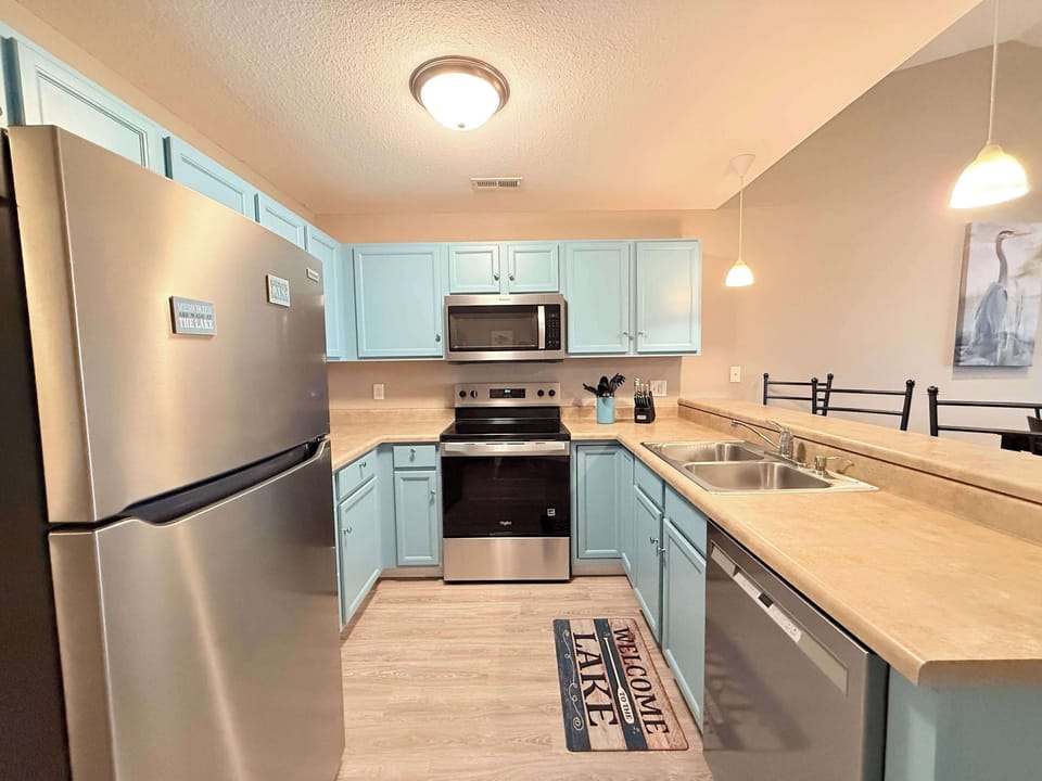 This quaint kitchen offers ample space & all the comforts of home
