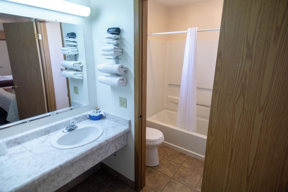 Combined shower/tub, hair dryer, towels, soap
