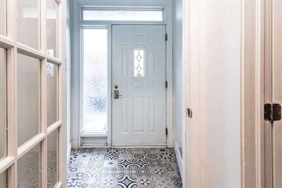 Bright white entrance area offering a clean and welcoming first impression as you step into the home.