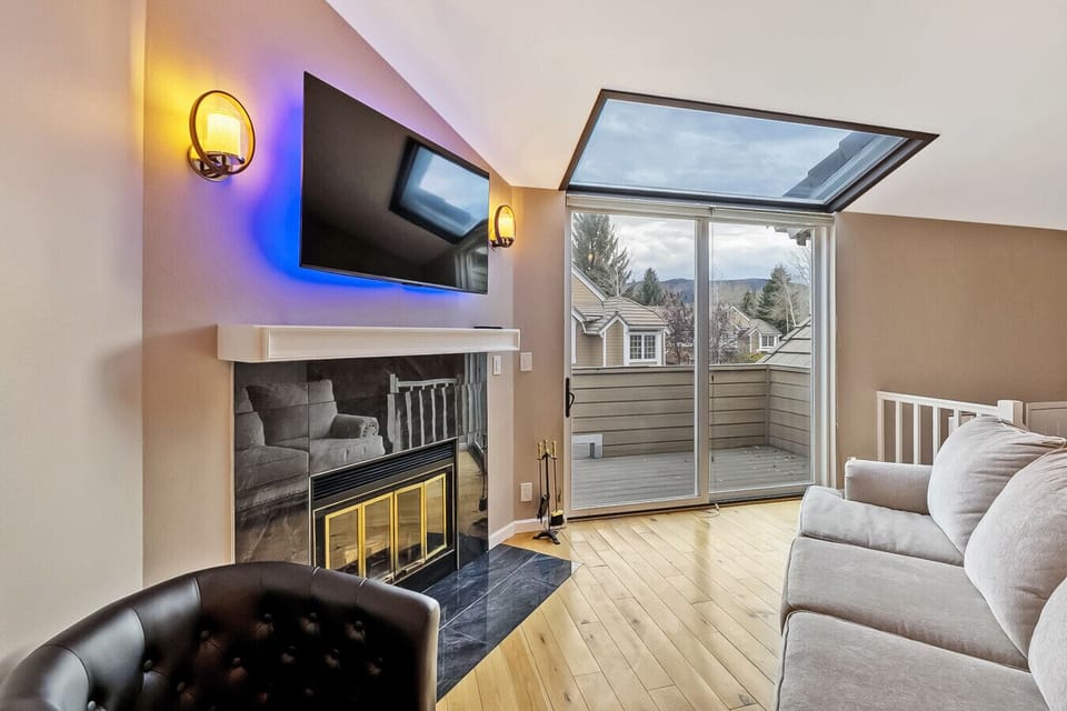 Living Room w/ Fireplace to Patio