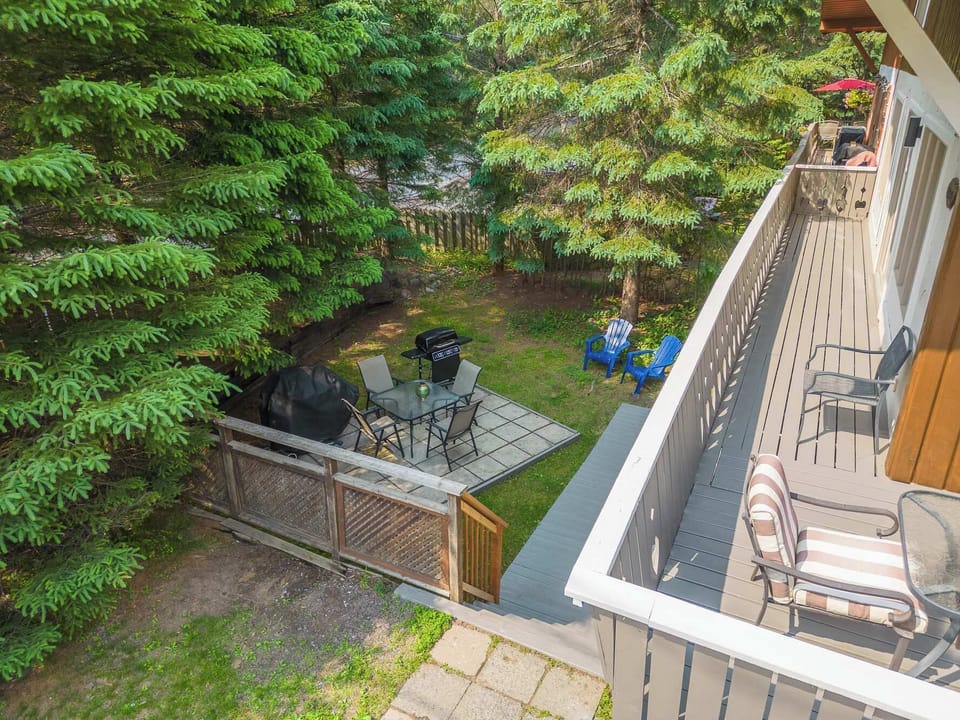     Elevated balcony view overlooking the peaceful outdoor seating area.