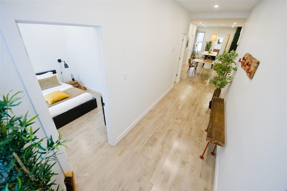 Bright open layout connecting bedroom and living areas, creating a spacious and airy feel.