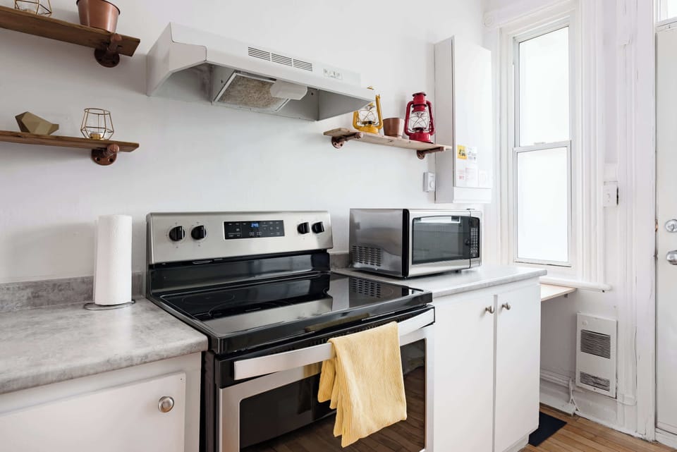 Fully equipped kitchen with modern appliances, designed for convenience and functionality.