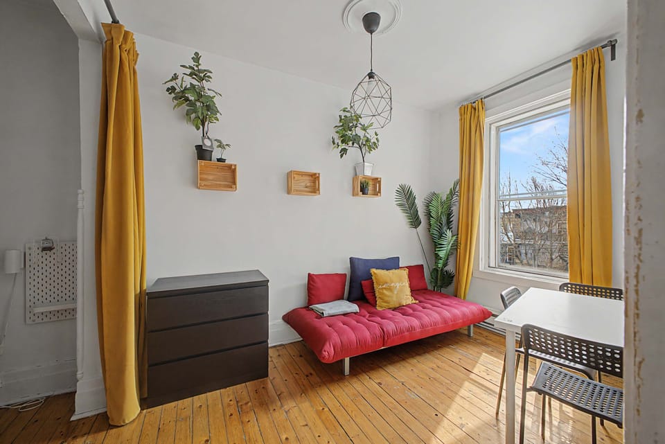 Cozy lounge area with a stylish sofa, perfect for unwinding after a day in the city.