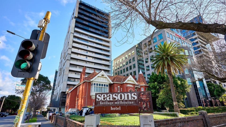 Modern high-rise living towering beautifully behind a charming, heritage-listed facade.