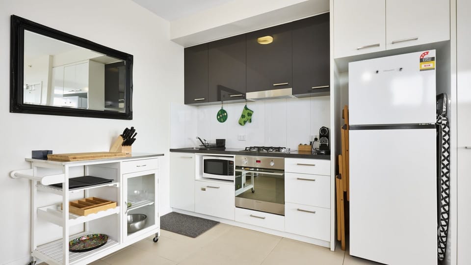 Compact modern kitchen fully equipped with practical storage and everyday convenience.