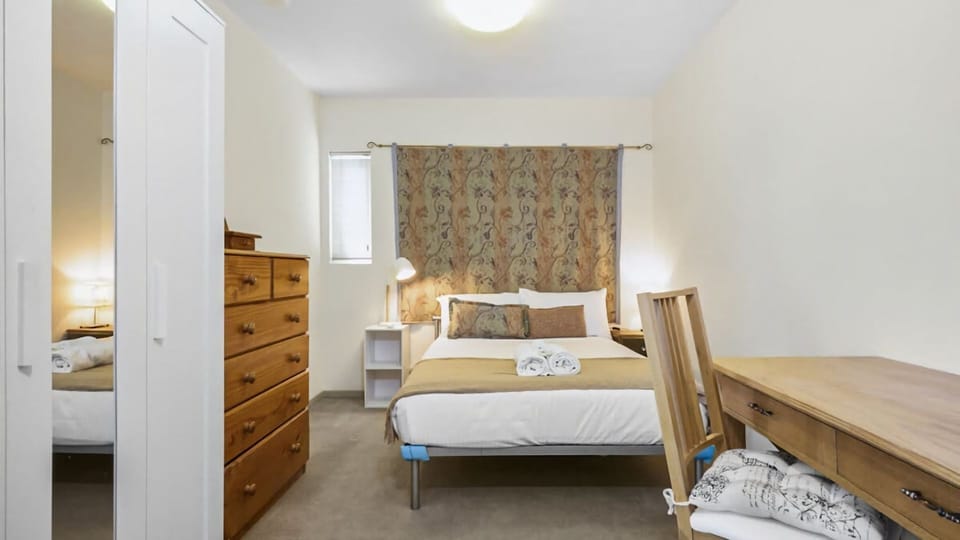 Bedroom with dedicated workspace