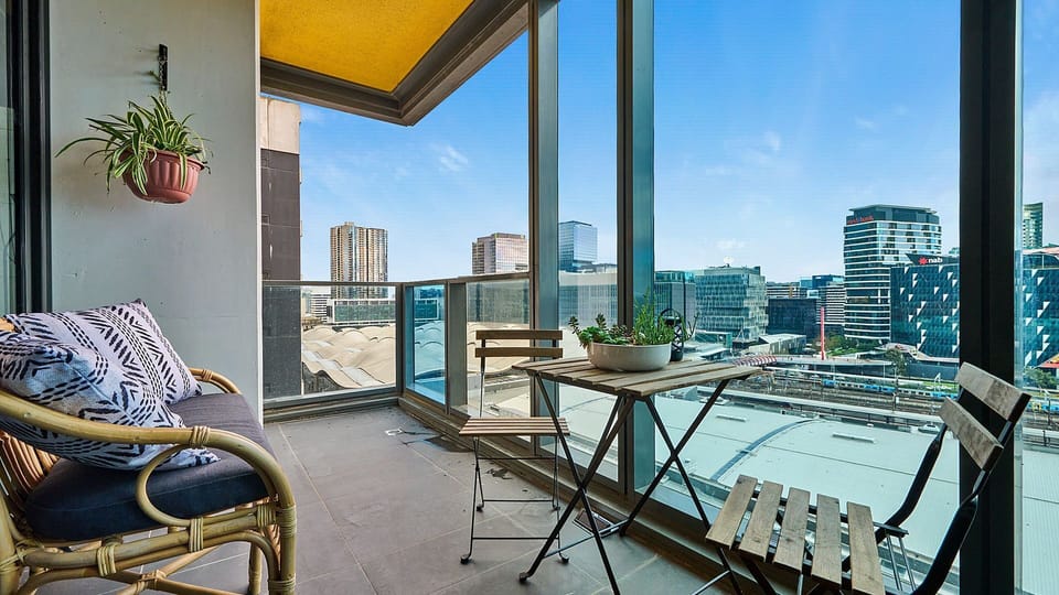 Private balcony with cosy seating and skyline outlook