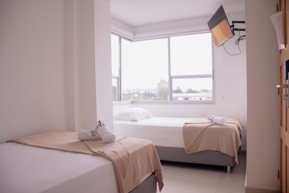 Classic Triple Room, City View | Hypo-allergenic bedding, laptop workspace, free WiFi, bed sheets