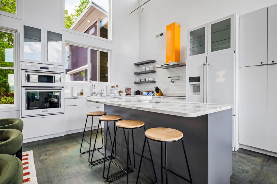 Modern kitchen stocked for cooking, snacking, and hosting.