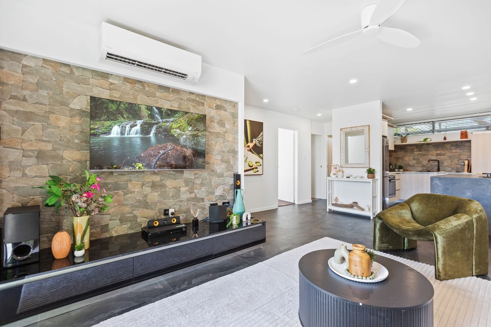 Deluxe Apartment, Balcony, Beach View | Living room | 50-inch Smart TV with cable channels, Netflix, streaming services