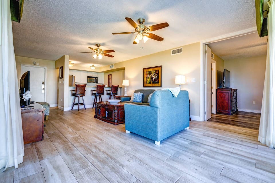 The open floor plan seamlessly connects the living room & kitchen, creating a spacious and inviting flow perfect for entertaining & family gatherings.