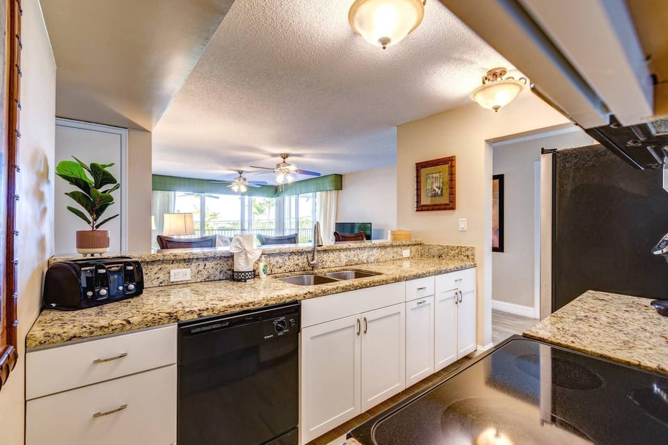 Enjoy the stunning view while preparing meals, with large sliders that bring the outdoors in, creating a bright and inspiring cooking space.