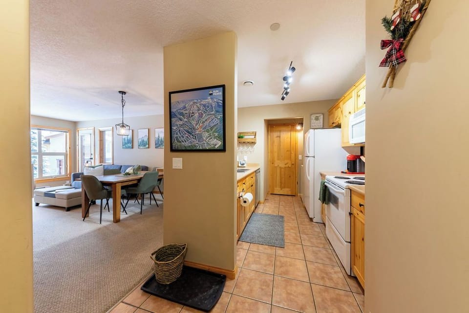Warm entryway with heated floors and mountain-inspired decor