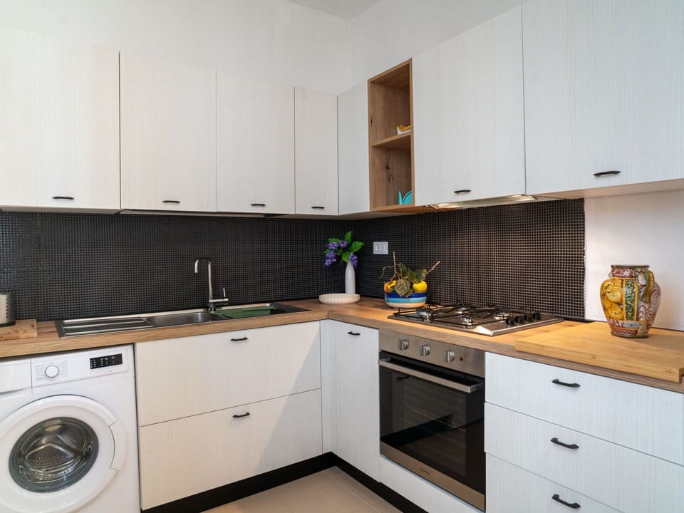 Cabinetry, Countertop, Property, Sink, Kitchen Sink, Tap, Kitchen, Kitchen Stove, Clothes Dryer, Kitchen Appliance