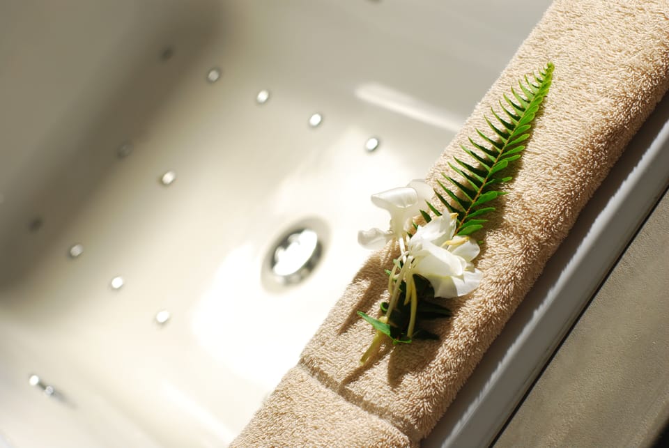 Honeymoon Suite, 1 King Bed (6) | Bathroom | Rainfall showerhead, hair dryer, bathrobes, towels