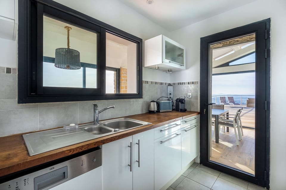 Comfort Villa, Sea View | Private kitchen | Electric kettle, highchair