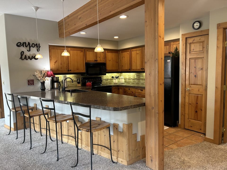 Fully Stocked Kitchen with Bar Seating and Mountain Views