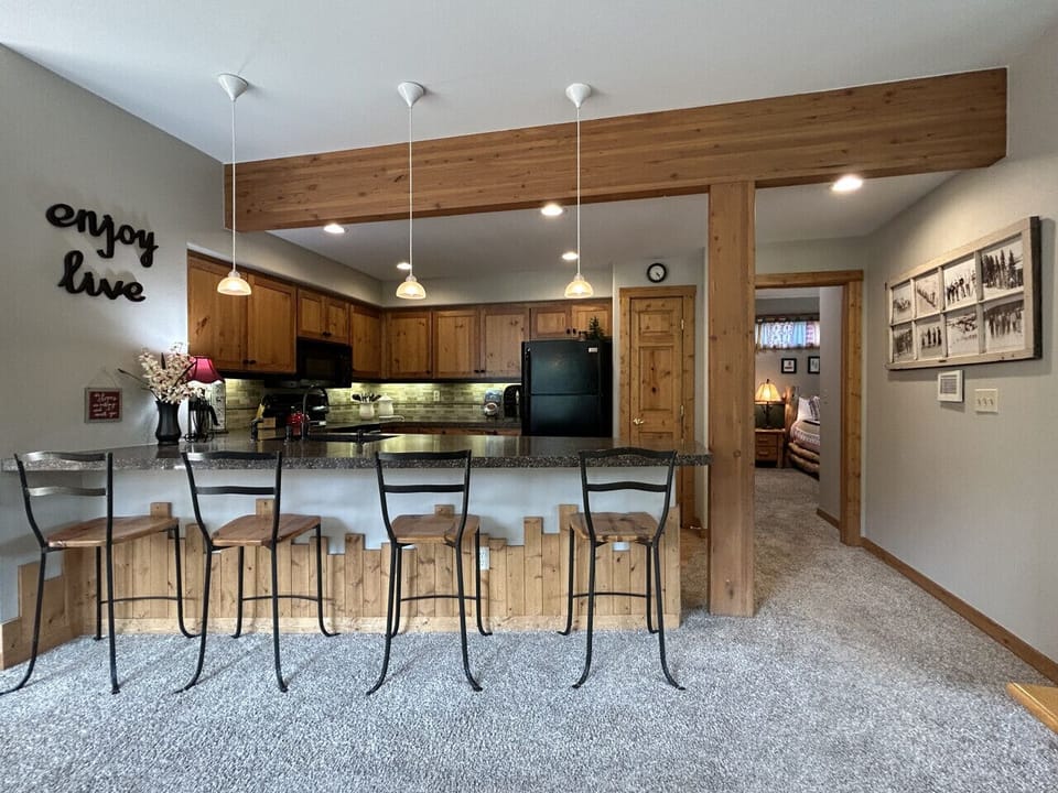 Fully Stocked Kitchen with Bar Seating and Mountain Views