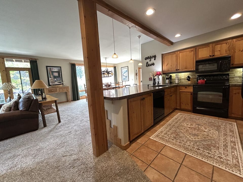 Fully Stocked Kitchen with Bar Seating and Mountain Views