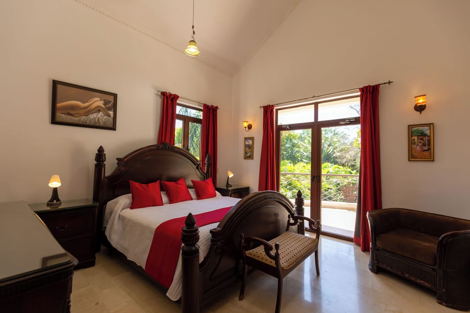 Retreat to the main room featuring a luxurious king bed and a spacious private bathroom. Each room in the villa is equipped with air conditioning, ensuring a comfortable stay throughout.