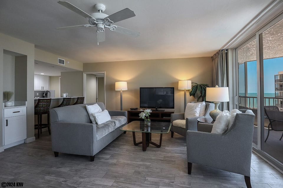 Living Area has a huge TV and comfortable seating